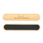 A bamboo nail file with a black sanding surface and branding on the top.