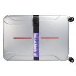 A silver suitcase secured with a black luggage strap, featuring a colorful logo.