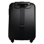A black suitcase featuring a sleek luggage strap securing it in place.