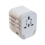 A travel adaptor featuring multiple plug configurations and a USB port, designed for international use.