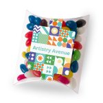 Assorted mini jelly beans in various colours displayed in a clear pillow pack with a patterned label.