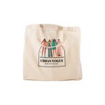 A short handle calico bag in cream featuring a logo and a colorful illustration of fashionable figures.