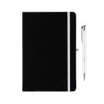 A black notebook with a white elastic band and a silver pen beside it. The notebook has a branding logo.