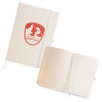 A light-colored A5 notebook with a logo on the cover and lined pages inside. It features an elastic closure.