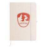A cream-colored A5 notebook with a red logo featuring mountains on the front cover and an elastic band closure.