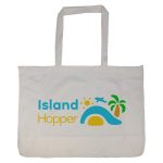 A large reusable grocery bag in cream featuring a colourful logo with a sun, palm tree, and wave design.