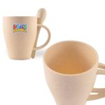 A wheat fibre cup in a beige colour with a matching spoon attached. The cup features a logo.