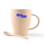 A wheat fibre cup in a light beige color with a matching spoon. The cup has a logo on it.