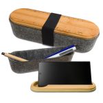 A gray felt utility case with a bamboo lid, featuring a ruler design and holding a pen and phone.