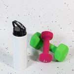 A drink bottle featuring a flip straw lid, alongside a pair of colorful dumbbells.