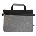 A grey felt satchel with a black top panel, featuring a zippered pocket and a short handle. It has a logo.