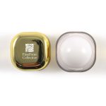 A gold and clear cosmetic jar with a logo on the lid, featuring a smooth, white interior.