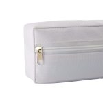 A white utility case featuring a zippered pocket and a textured fabric surface. It has a sleek, rectangular design.