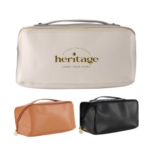 A toiletry bag in beige, with a gold logo, accompanied by orange and black versions. Features a zipper and handle.