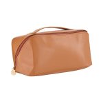 A tan toiletry bag with a smooth finish and a zippered closure, featuring a handle on top and a logo.