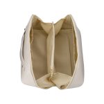 A cream-coloured toiletry bag with a spacious interior featuring multiple compartments and a zippered section.