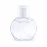 A clear, round bottle of gel hand sanitiser with a white pump top. The gel contains small bubbles.