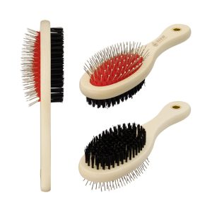 A pet grooming brush with a cream handle, featuring red and black bristles. The brush has a rounded design and logo.