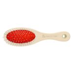 A pet grooming brush featuring a wooden handle and a red rubber base with metal bristles. It has a logo on the handle.
