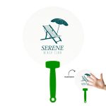 A round fan with a transparent surface, featuring a green handle and a design of a beach chair and umbrella.