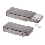 A silver slider tin containing sugar-free breath mints, with a few mints visible outside.