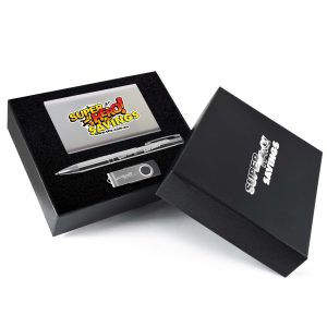 A gift set featuring a pen, a USB drive, and a metallic card, all presented in a black box with branding.