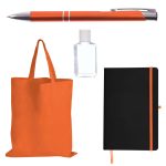 An orange tote bag, an orange pen, a small clear bottle, and a black notebook with an orange elastic closure.