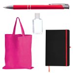 A red pen, a clear bottle of hand sanitizer, a pink tote bag, and a black notebook with an orange elastic band.