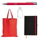 A red pen, a clear hand sanitizer bottle, a red tote bag, and a black notebook with a red elastic band.