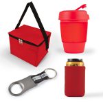 A red cooler bag, a red drink cup with a lid, a silver bottle opener, and a red can cooler.