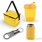 A yellow cooler bag, a yellow drink cup, a can cooler, and a bottle opener with a keyring.