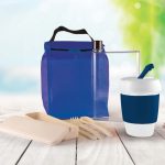 A blue picnic pack featuring a drink bottle, reusable cup, utensils, and a cool bag.