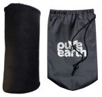 A soft black Polar Blanket rolled up beside a drawstring bag featuring the "Pure Earth" logo.