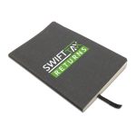 A recycled leather notebook with a soft cover, featuring "SWIFT TAX RETURNS" printed on the front.
