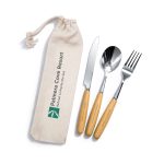 A cutlery set with a knife, fork, and spoon, featuring wooden handles, stored in a beige pouch with a logo.