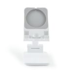 A white phone stand featuring an adjustable holder and a flat base, suitable for various smartphone sizes.