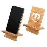 A bamboo phone stand displaying a smartphone, featuring a logo on one side and a smooth wooden finish.