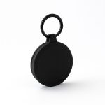 A black round keychain with a textured surface and a keyring attachment.