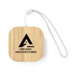 A square bamboo cable organiser with a silver strap, featuring a black logo on the front.