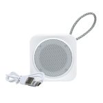 A white Pep Mini Speaker with a textured carry strap and a USB charging cable.