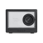 A black speaker with a transparent front and a visible speaker driver, featuring control buttons below.