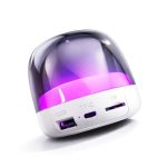 A compact speaker featuring a glossy purple dome and white base, with USB and auxiliary ports.