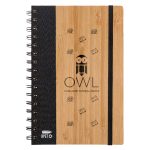 A bamboo A5 notebook featuring a black cover and spiral binding, with a logo and simple illustrations.