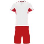 A sports uniform featuring a white and red short-sleeve top with matching red shorts. It includes a logo.