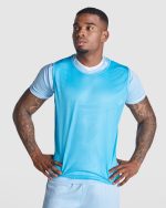 A light blue sports bib made from breathable material, featuring a logo on the front.