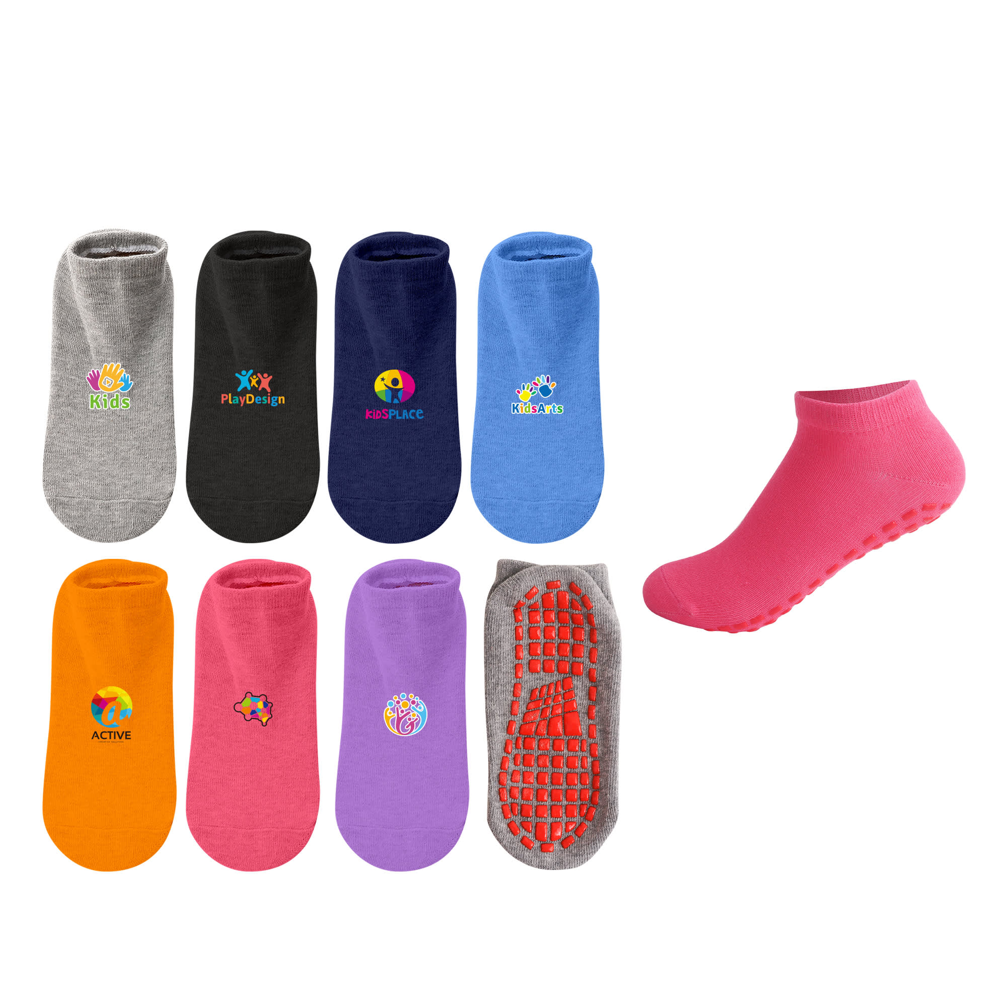 A variety of low cut kids gripper socks in grey, black, navy, orange, purple, and pink, featuring different logos. Low Cut Kids Gripper Socks - Image 1