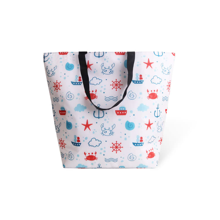 A large cooler tote bag in white, featuring a playful nautical pattern with red and blue elements, and black handles. Polyester Large Cooler Tote Bag - Image 1
