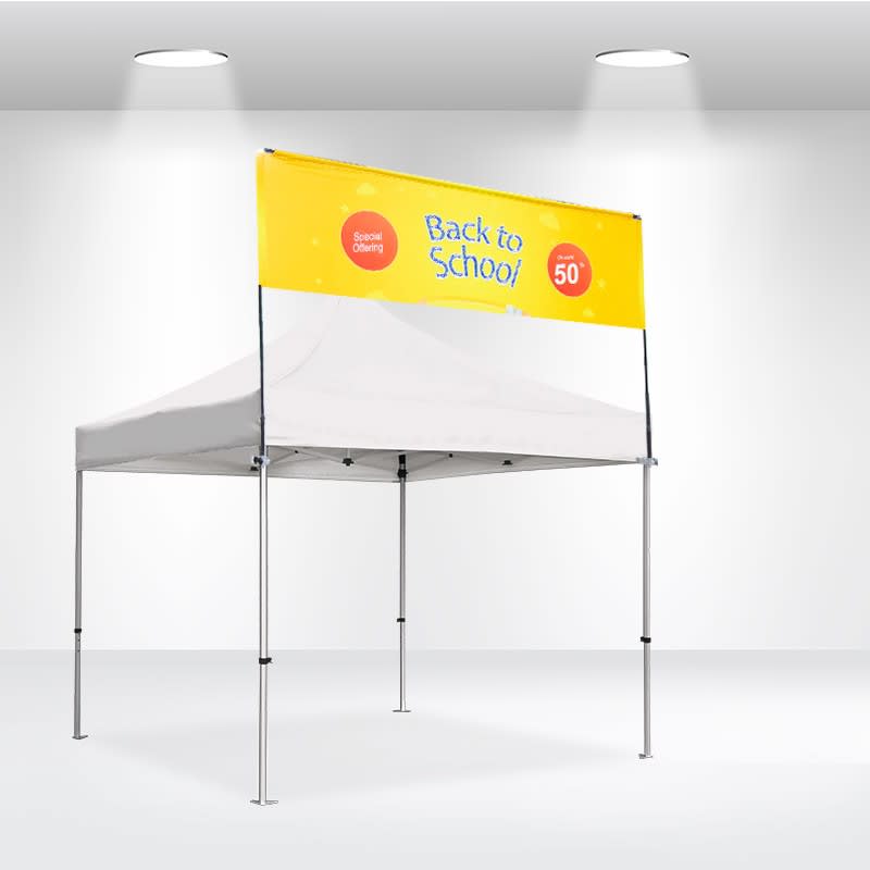 A white square tent with a yellow banner featuring a logo. The tent has a sturdy frame and is set up indoors. Square Tent Billboard Banner 10x10ft - Image 1