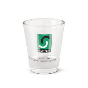 A Boston shot glass featuring a colorful logo design.