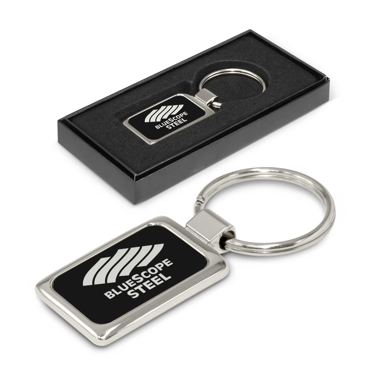 A metal key ring with a rectangular shape featuring a logo. The key ring is presented in a black box. Laser Etch Metal Key Ring - Image 1